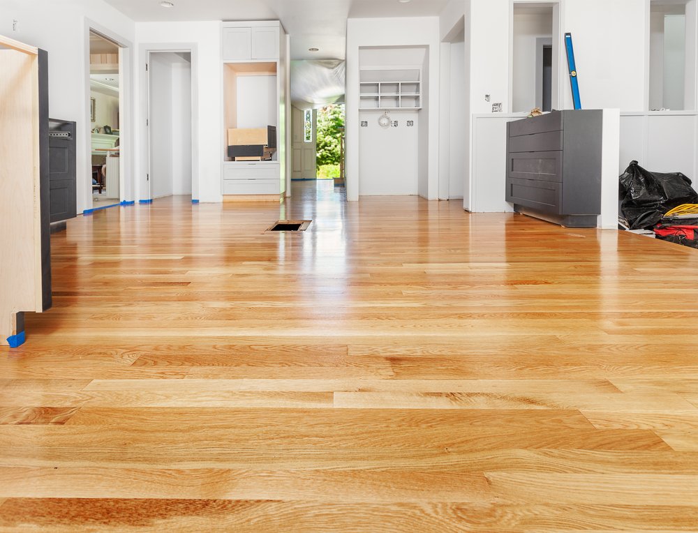 A wood floor during a hardwood floor resurfacing